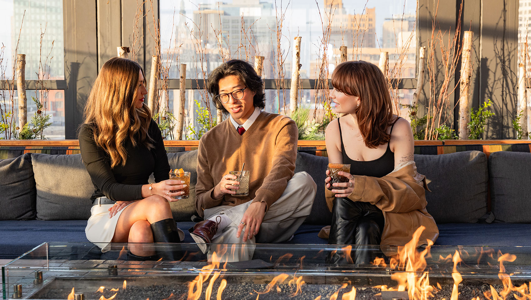 people chatting by fire pit
