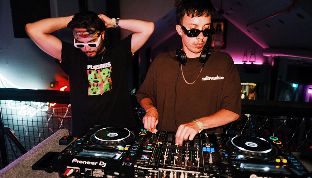 Two DJs at the turntables at Outsider